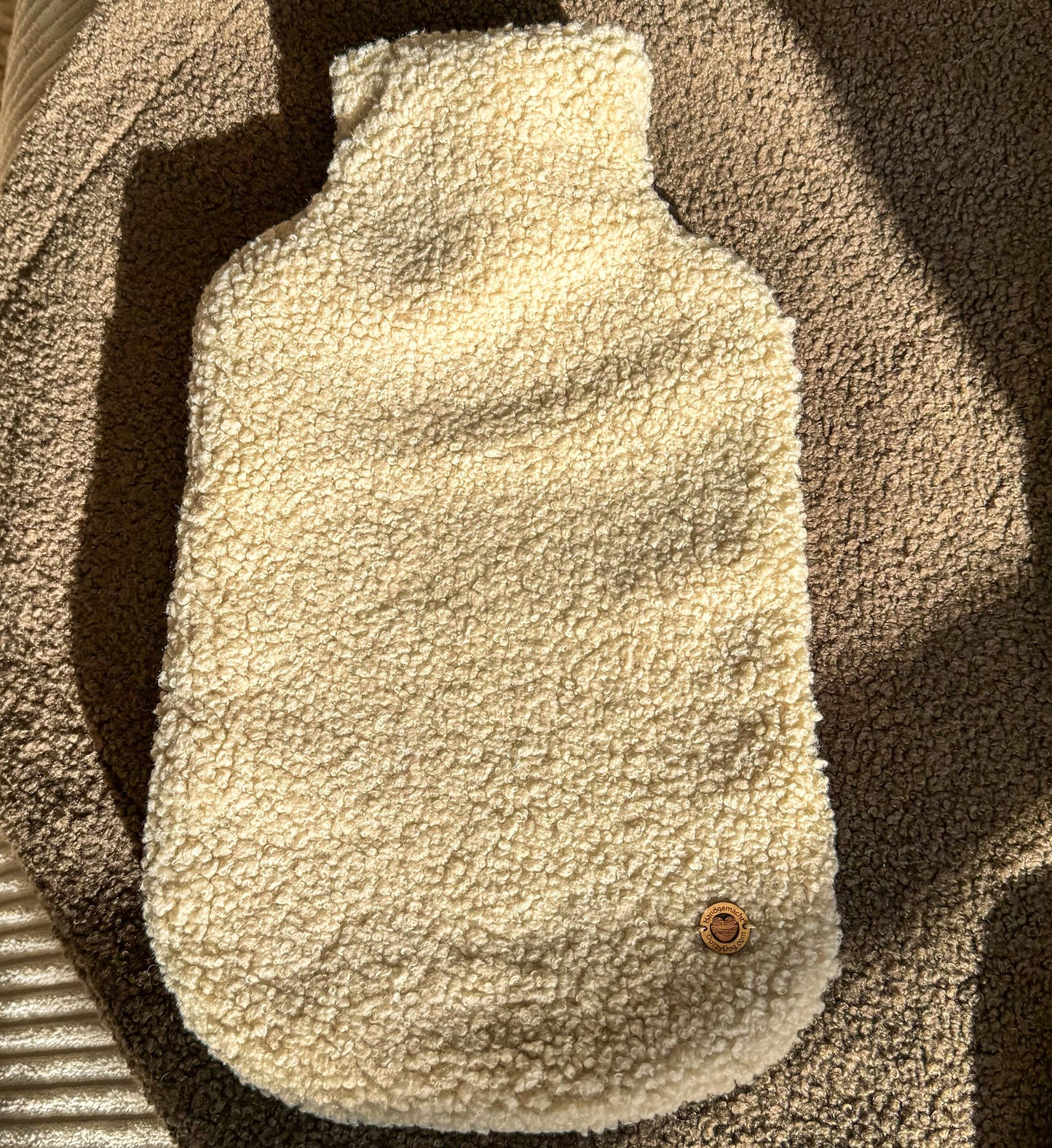 Poufet Wärmflaschen in verschiedenen Farben – handgemachte Bezüge aus Bouclé und Breitcord
